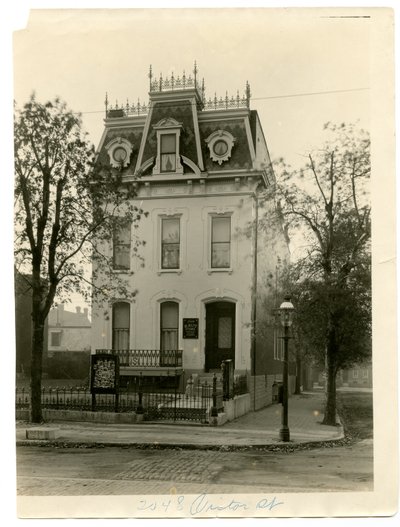 Three Story Stone and Brick Residence with Wrought Iron Railing on the Roof and Dormer Windows by William G. Swekosky